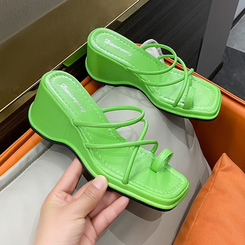 Platform Strappy Slip On Sandal With A Toe Strap Detail