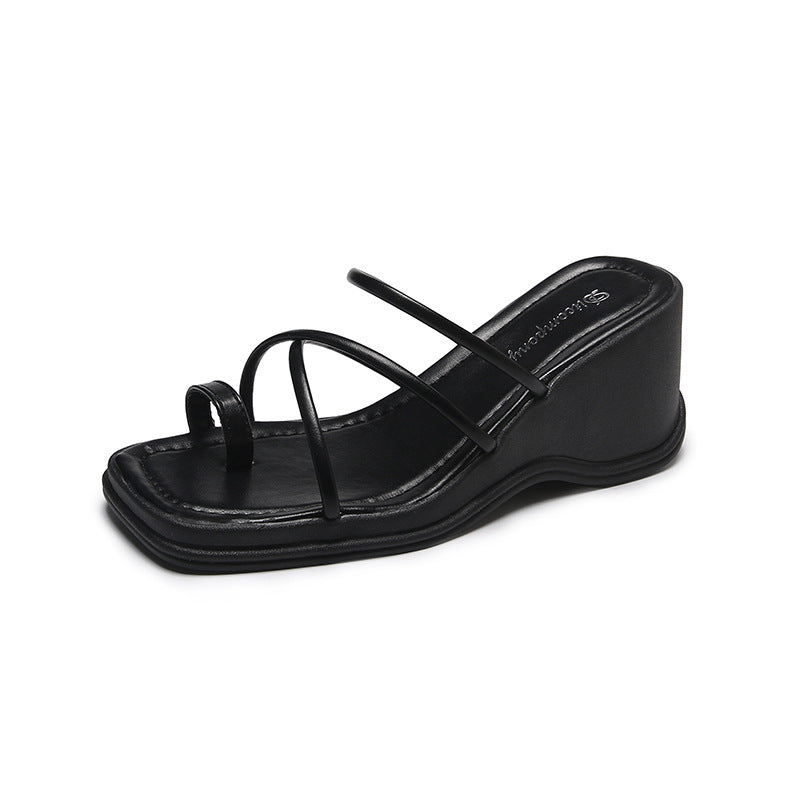 Platform Strappy Slip On Sandal With A Toe Strap Detail