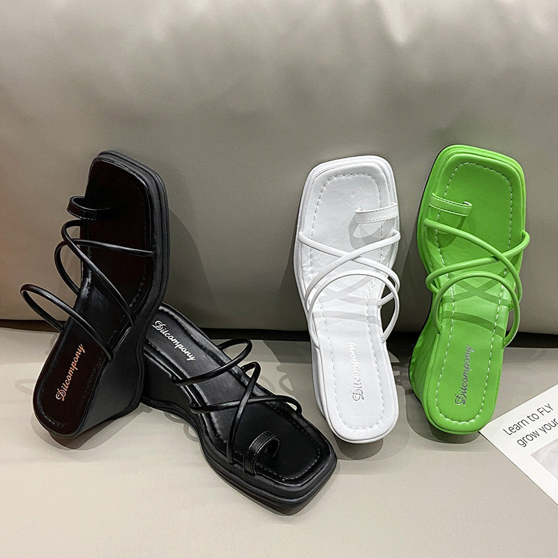 Platform Strappy Slip On Sandal With A Toe Strap Detail