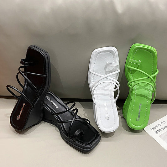 Platform Strappy Slip On Sandal With A Toe Strap Detail