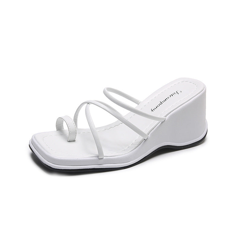 Platform Strappy Slip On Sandal With A Toe Strap Detail